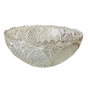 Beautiful vintage pressed glass bowl with sawtooth edge and beautiful patters